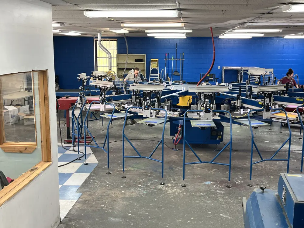 Screen printing press stations at Aaron's Designs, Red Oak TX